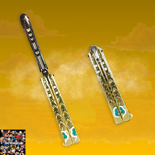 Gold-tone metal butterfly balisong trainer with engraved decorative pattern