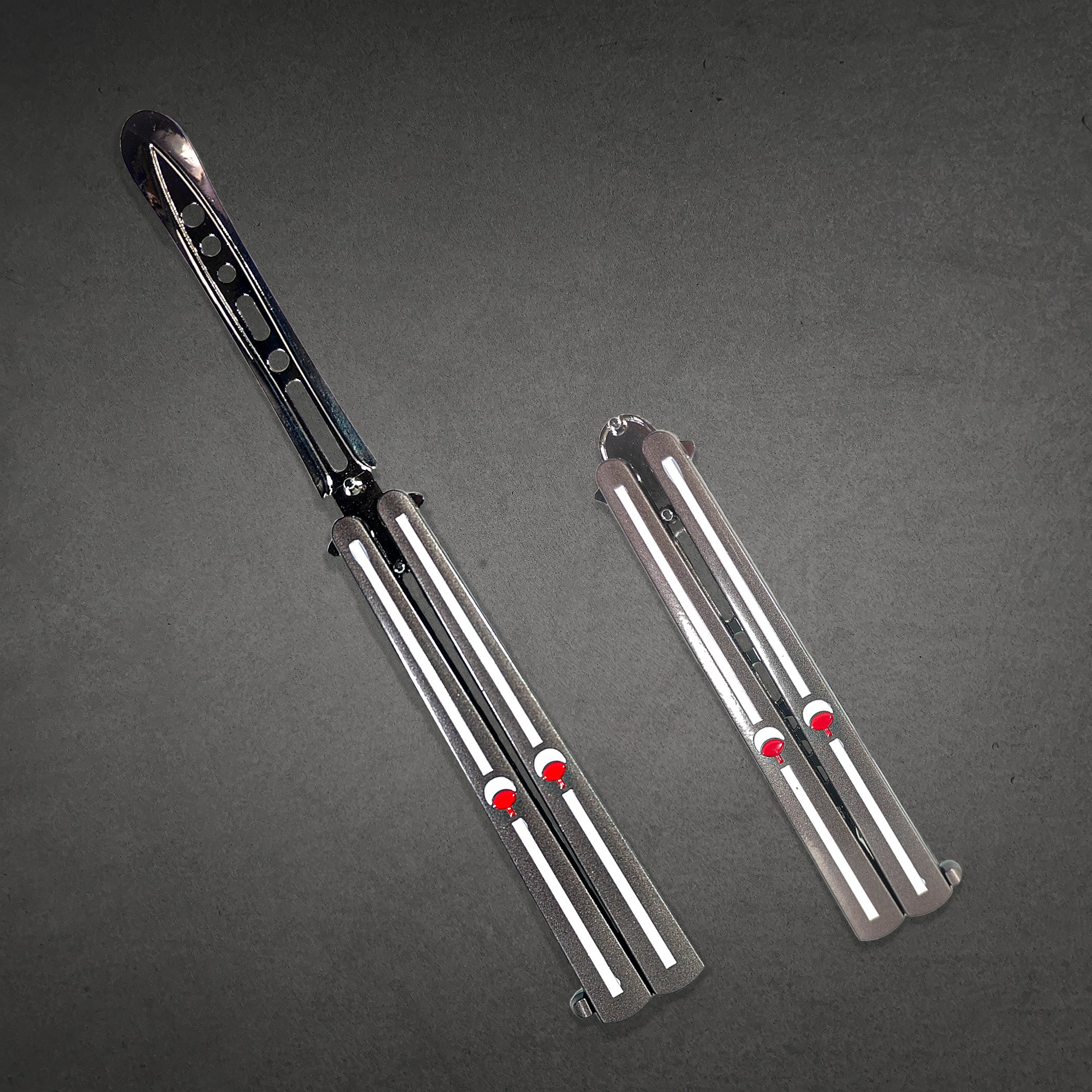 Uchiha Clan engraved metal butterfly knife trainer with smooth handles — anime-inspired balisong blade